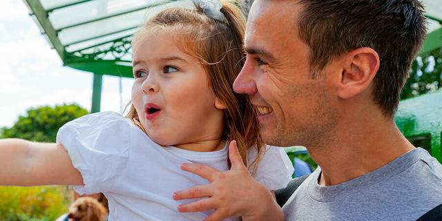Dad and child at tram stop 3000 x2000px 542366738