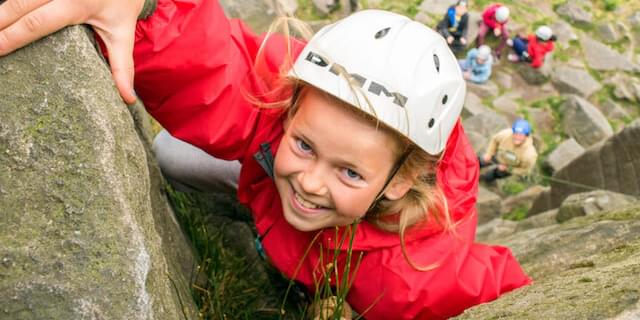 School Girl Rock Climbing