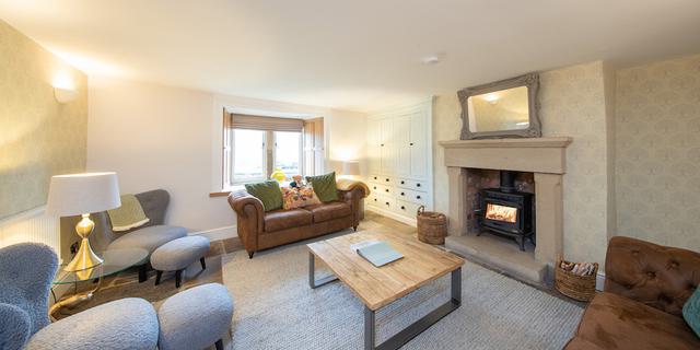 The Farmhouse sitting room with log burner